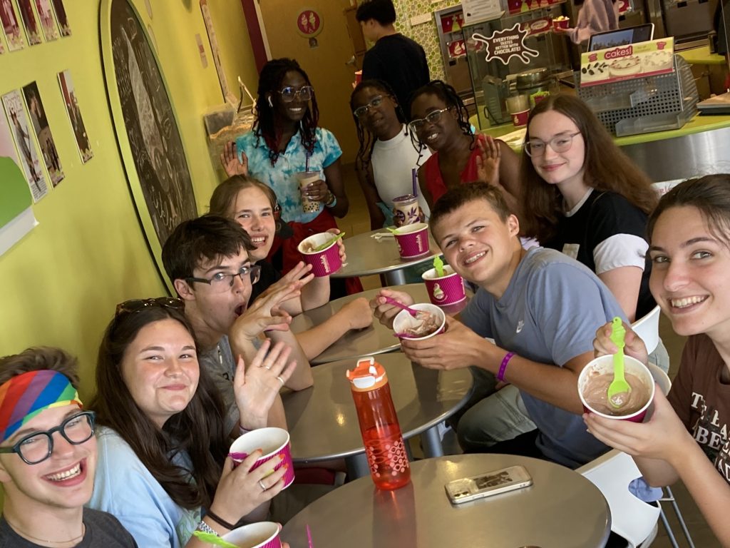 Youth eating frozen yogurt.